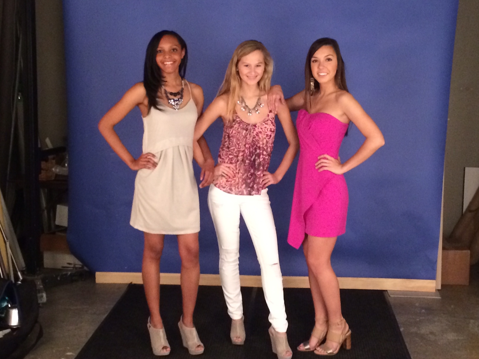 Maya is wearing a grey perforated dress by Olive and Oak, Blue sky necklace and Chinese Laundry Meet Up wedge in grey; Amelia is wearing Eight Sixty pink leopard top with Genetic Denim Shya white rip skinny and Kenze Panne silver and pink necklace; Ellen is wearing an Adelyn Rae magenta dress, DV Wendi heels and Kenze Panne bead and tassel earring.