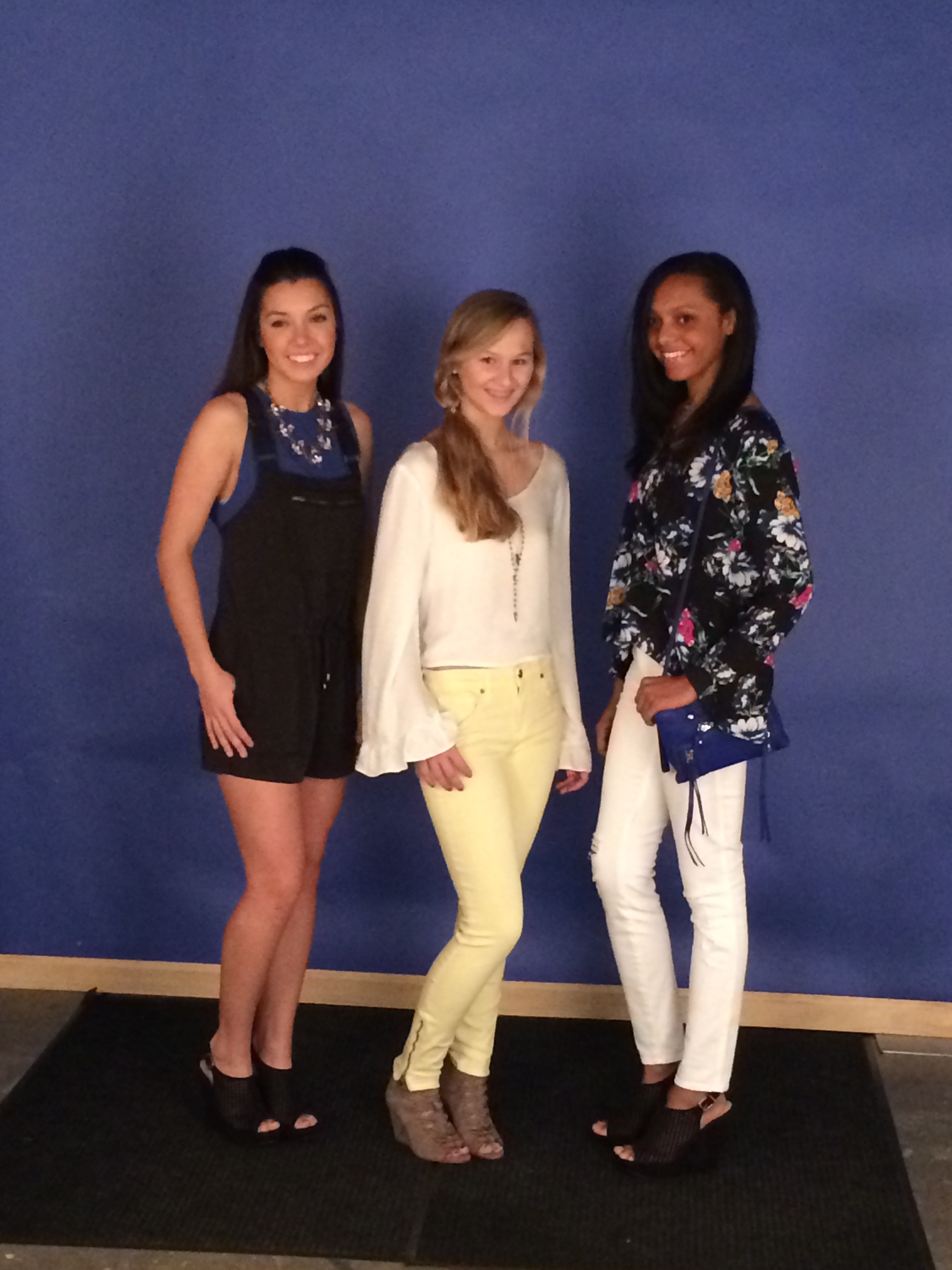 Ellen is wearing Eight Sixty blue tank, Free People shortall, Chinese Laundry Meet up Wedge in black and necklace by Kenze Panne; Amelia is wearing Mink Pink crop top with bell sleeve in white, Genetic Denim James yellow zip ankle skinny, DV sumner wedge in taupe, and Blue Sky layered necklace and Kitsch leatherette hair tie in leopard; Maya is wearing Eight Sixty floral top, Genetic Denim Shya ripped skinny in white, Botkier dark cobalt Logan wristlet and Chinese Laundry Meet Up in black.